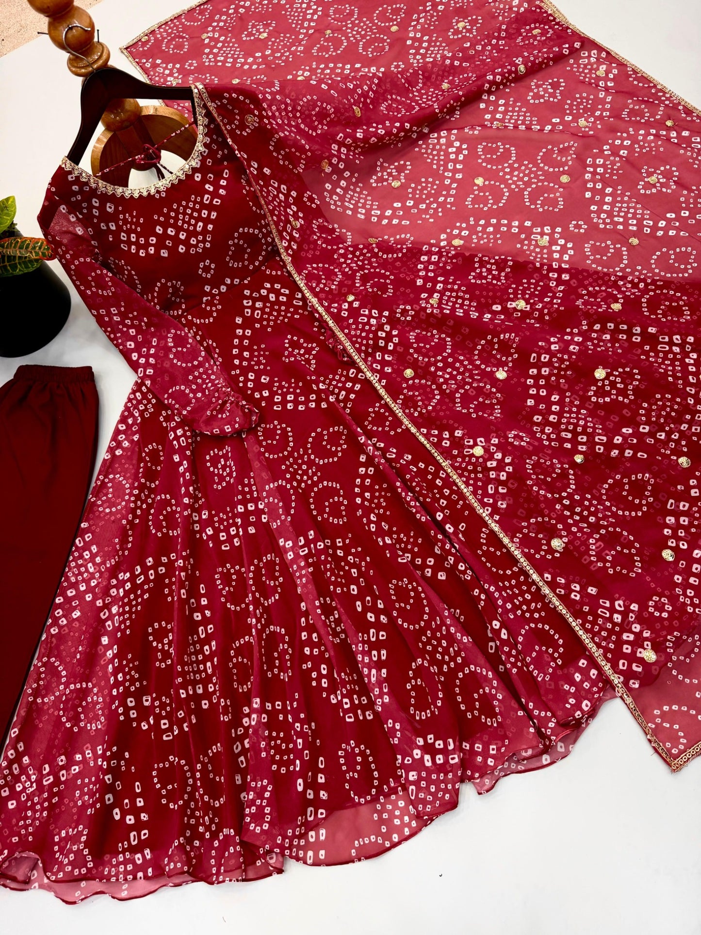 Red faux georgette gown and dupatta detailed flat lay