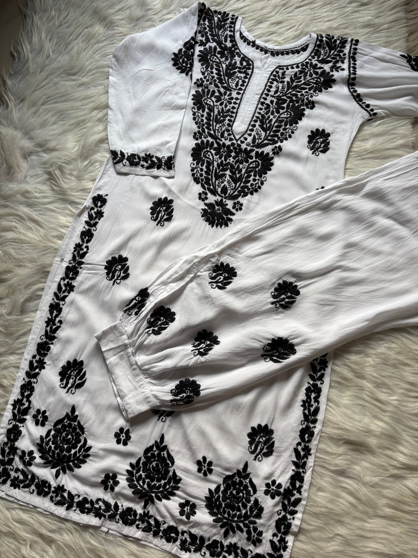 White black hand embroidered Lucknow Chikankari rayon kurta and shalwar set flatlay