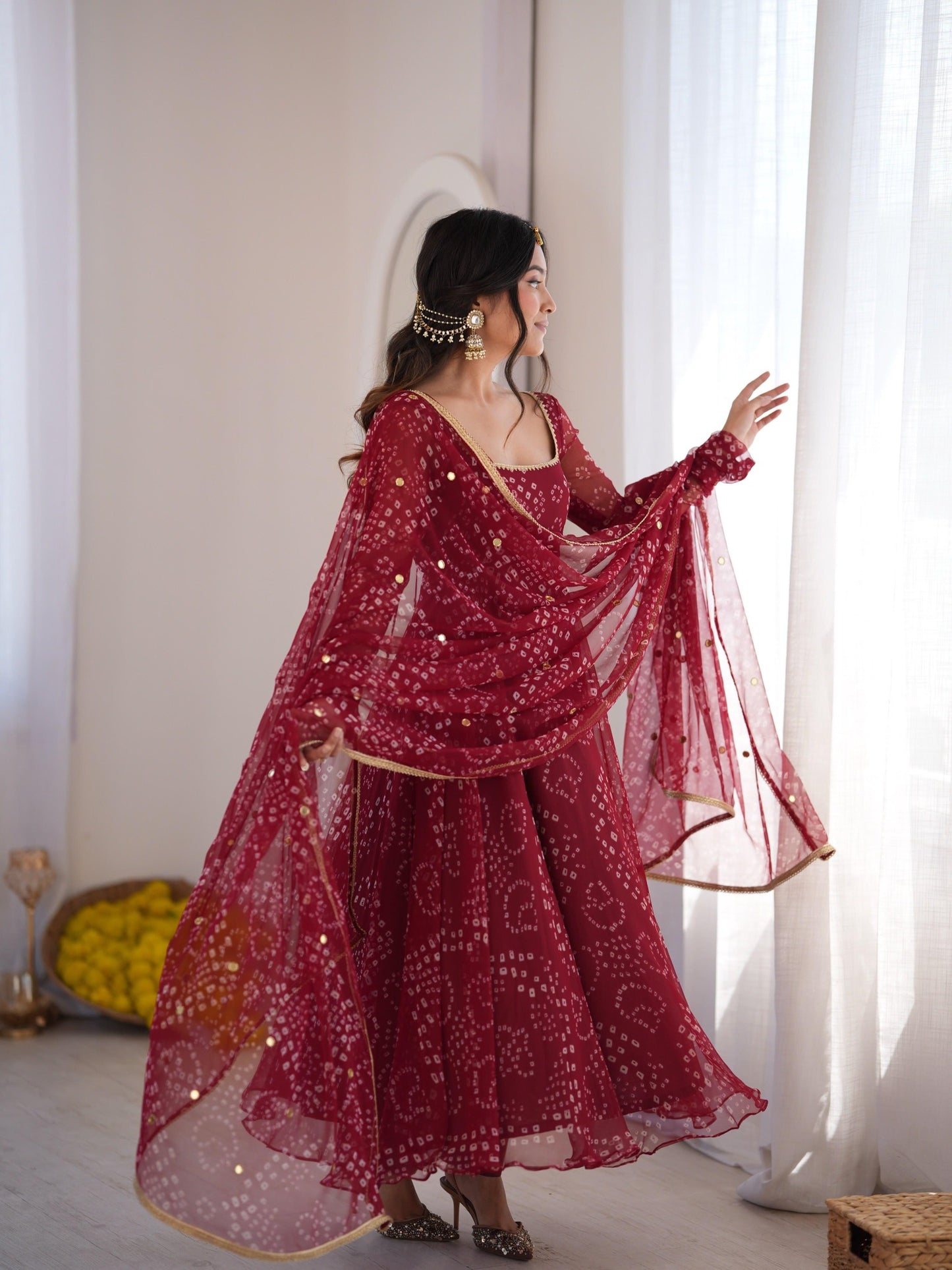 Red designer gown with flowing dupatta side view