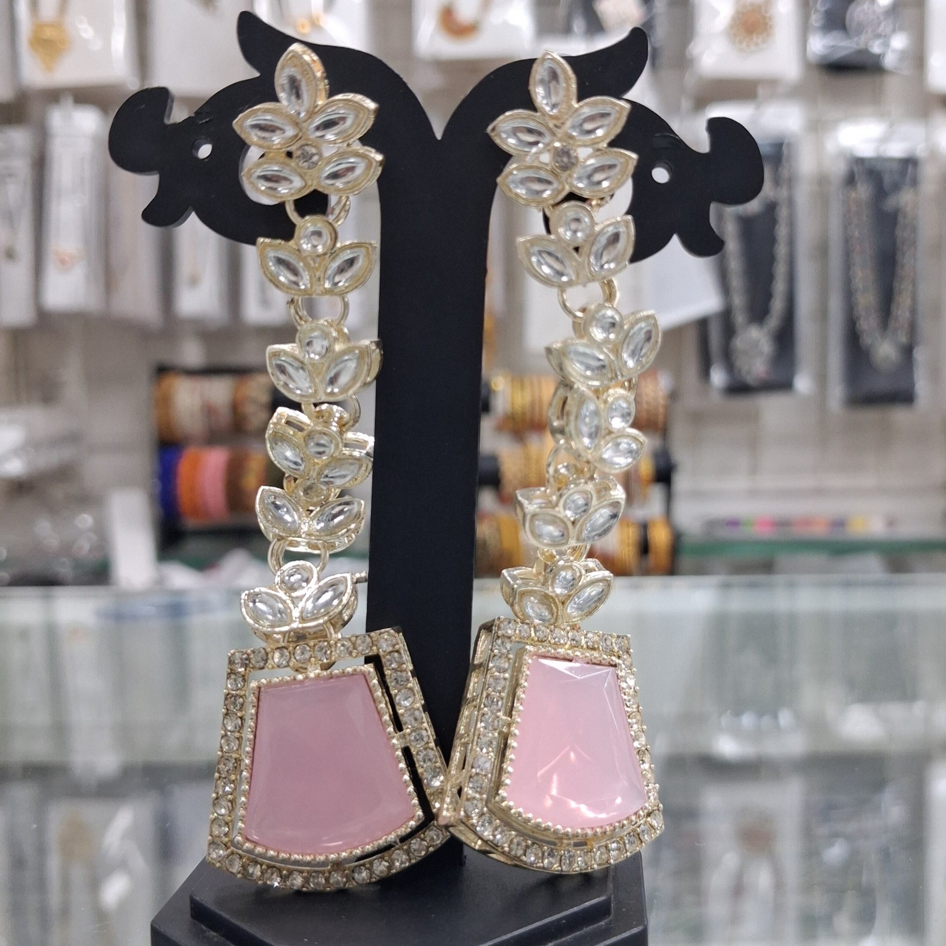 Baby pink imitation jewellery earrings display