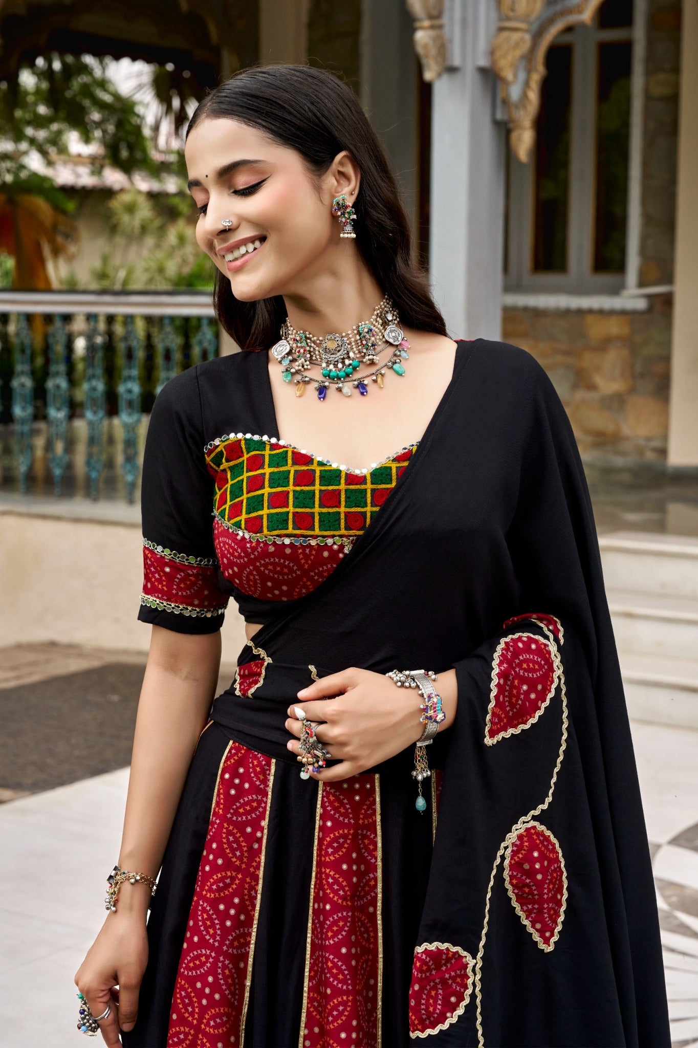 Black and red Ajrakh print lehenga blouse and mirror lace dupatta detail