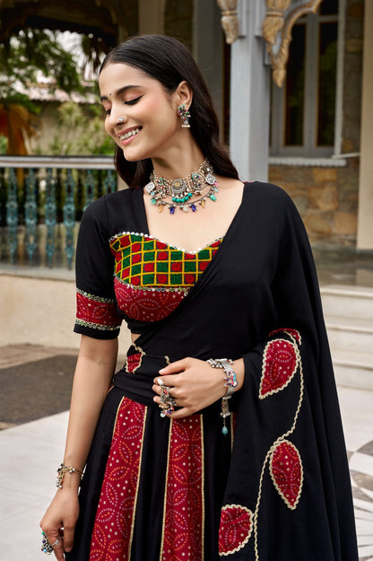 Black and red Ajrakh print lehenga blouse and mirror lace dupatta detail