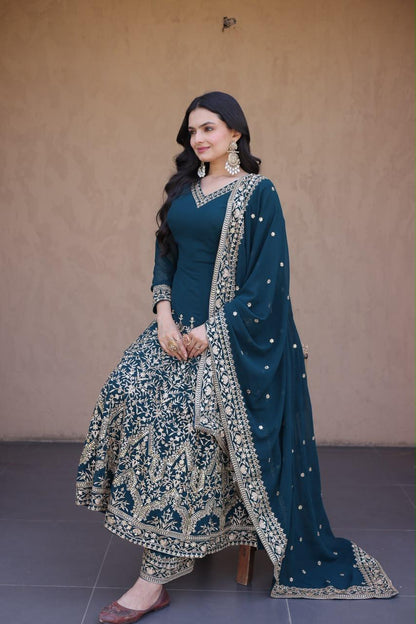 deep teal blue embroidered Anarkali gown set seated pose