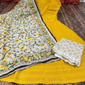 Design-2 Radiant Yellow Anarkali Set with Playful Pom Pom Dupatta Adorned with Sequence Work and Zari-Embroidered Chikan Palazzo.