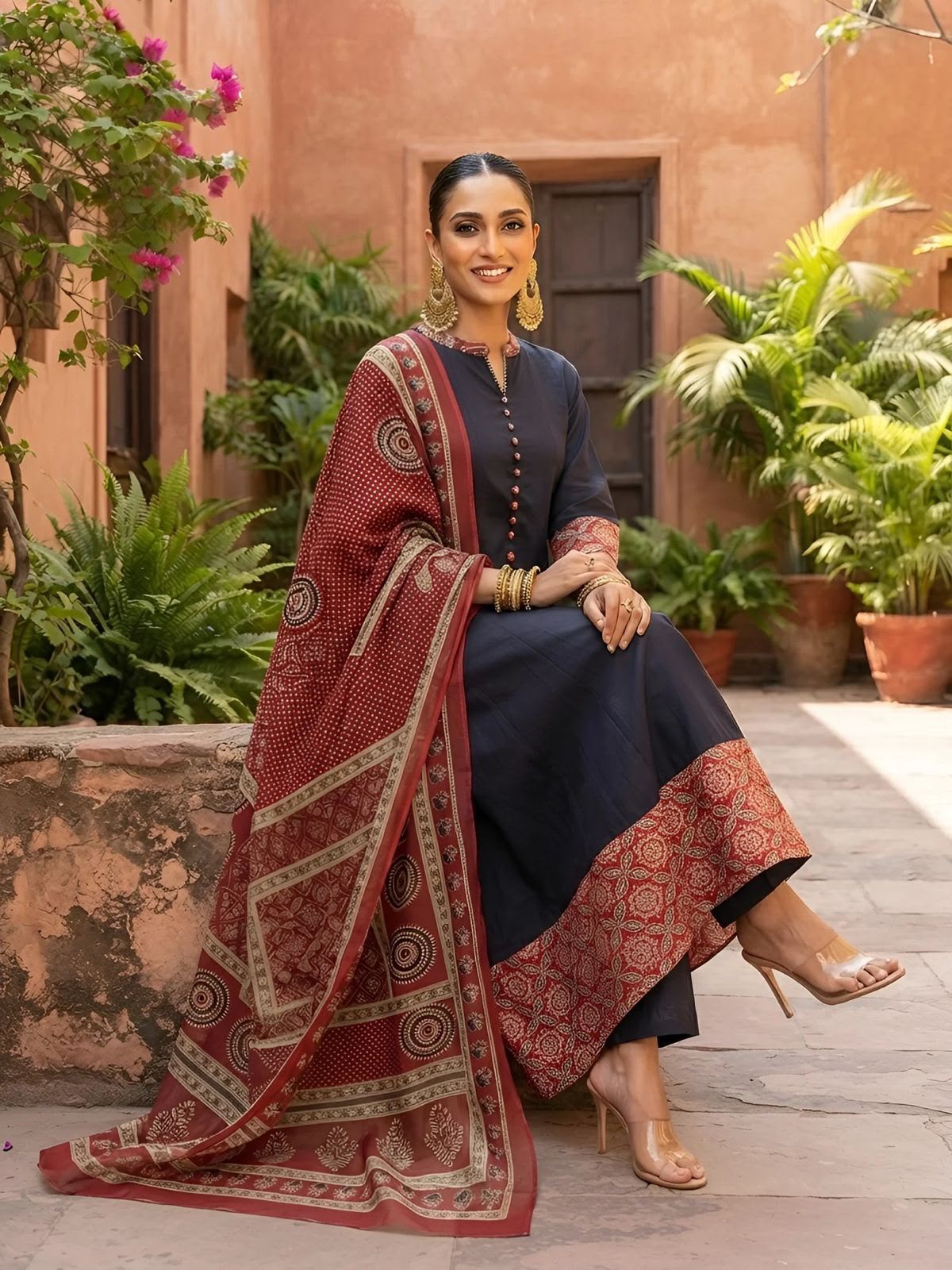 Black cotton Jaipuri Anarkali kurta pants set with maroon Bagru print dupatta - seated view | InayaKhan