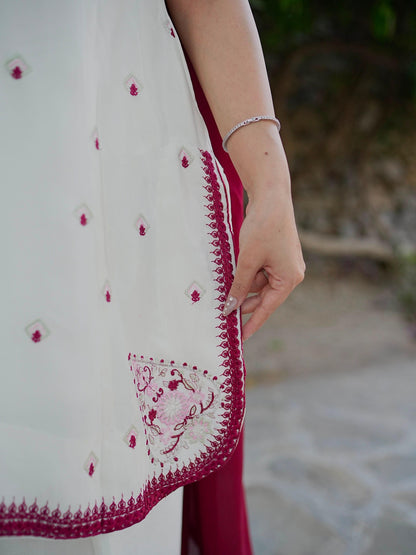 Ivory kurti wine embroidery and apple-cut hem detail