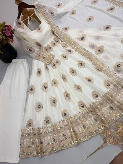 Ivory white Anarkali gown with peacock zari and sequin embroidery details