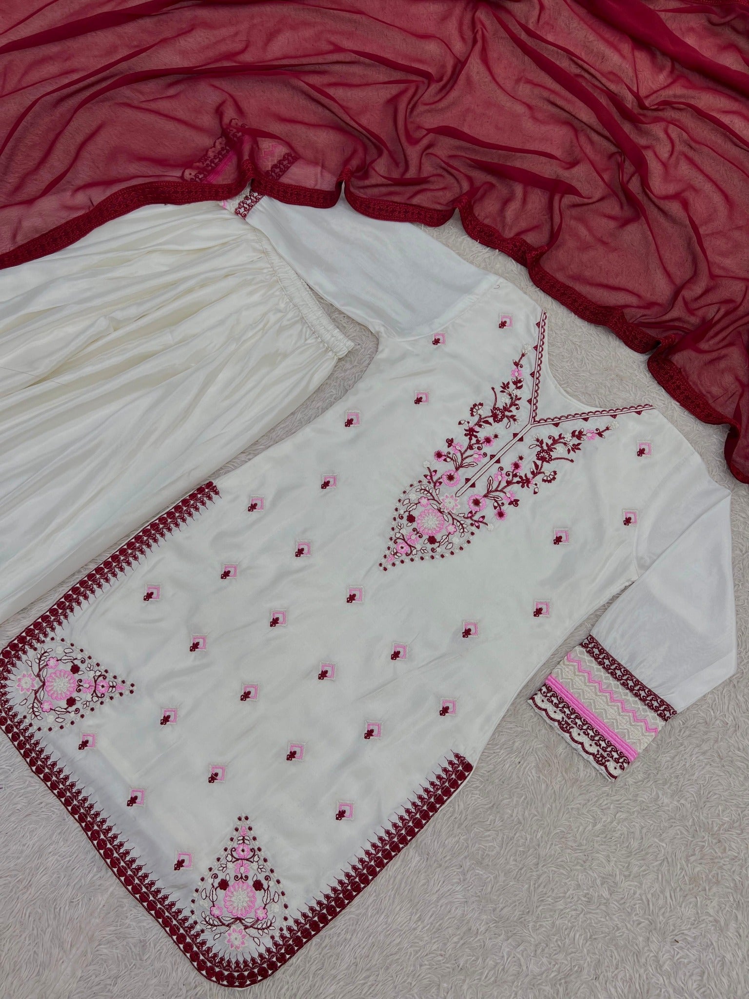 Ivory silk kurti wine and pink embroidery detail flat lay