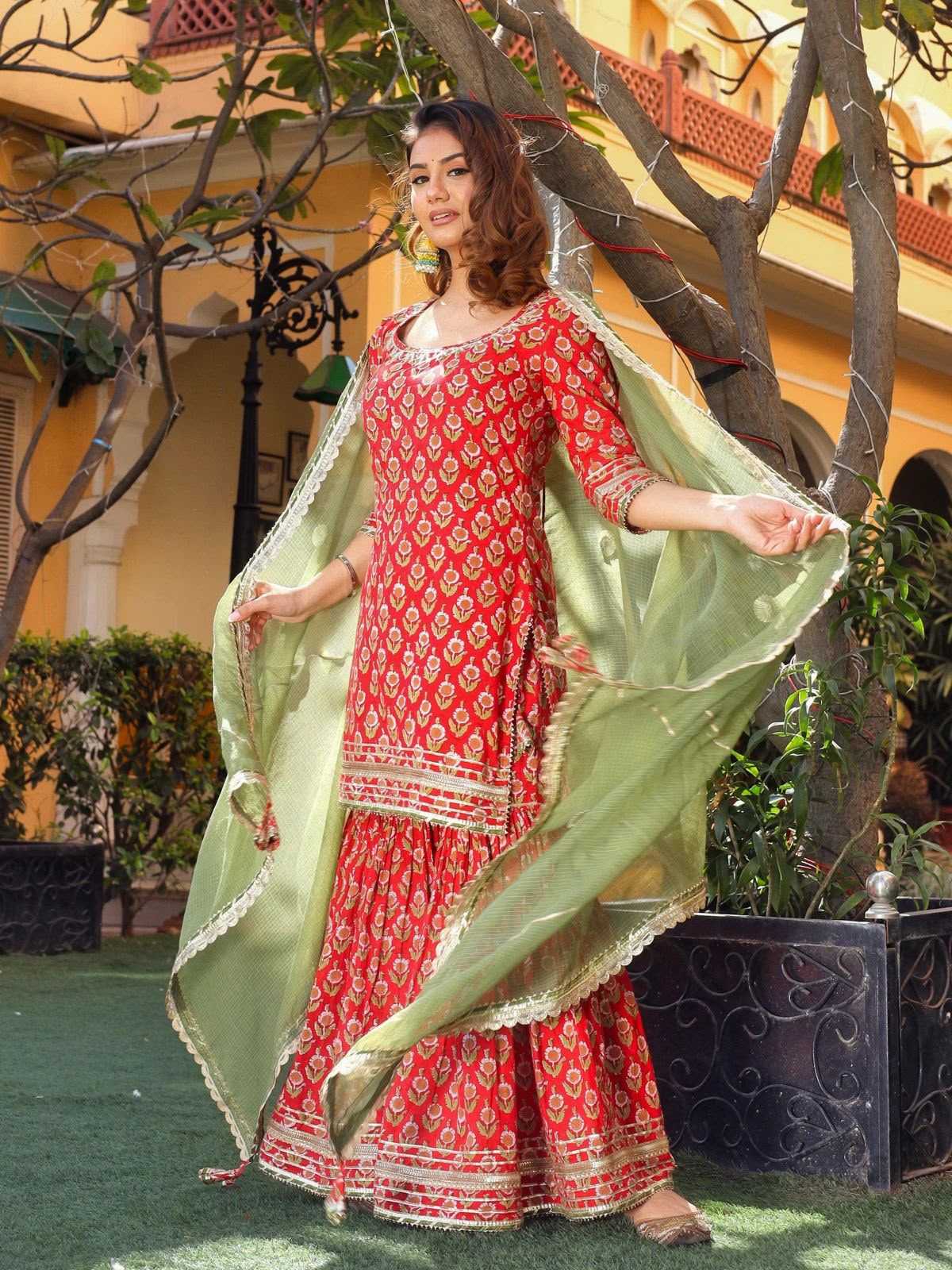 Red Dabu floral cotton kurta sharara and Mehandi green dupatta - lifestyle view