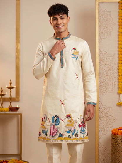 Cream men's kurta with colourful traditional embroidery detail