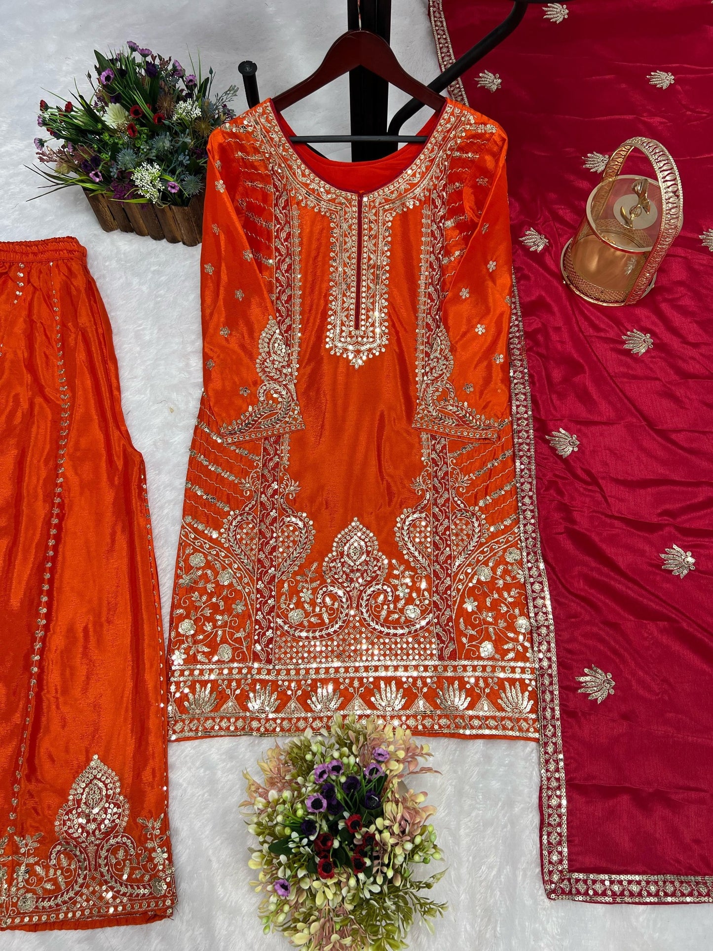Orange Chinon silk embroidered kurti palazzo and rani pink dupatta set flat lay