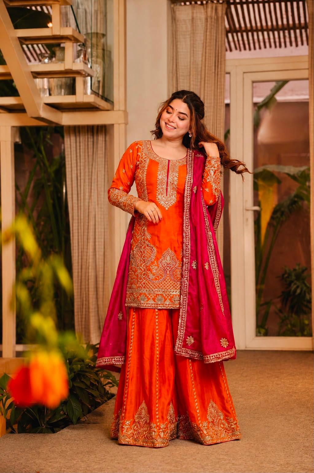 Full-length view of orange kurti palazzo ethnic set with rani pink dupatta