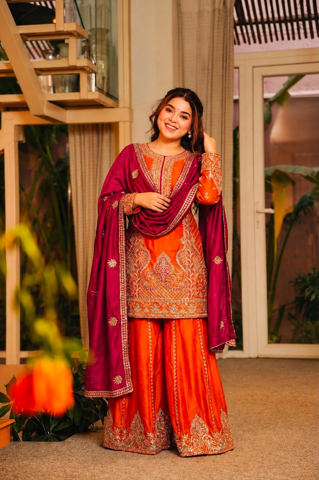 Orange embroidered kurti palazzo set styled with rani pink dupatta