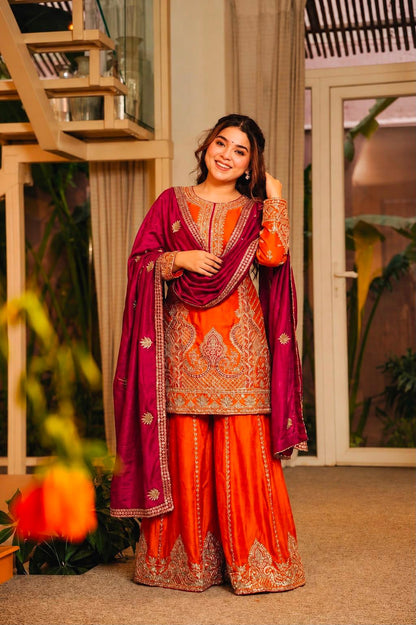 Orange embroidered kurti palazzo set styled with rani pink dupatta