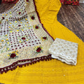 Radiant Yellow Anarkali Set with Playful Pom Pom Dupatta Adorned with Sequence Work and Zari-Embroidered Chikan Palazzo.