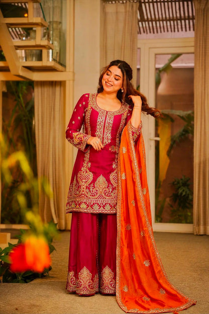 Model in Rani pink Chinon silk kurti palazzo set with orange dupatta
