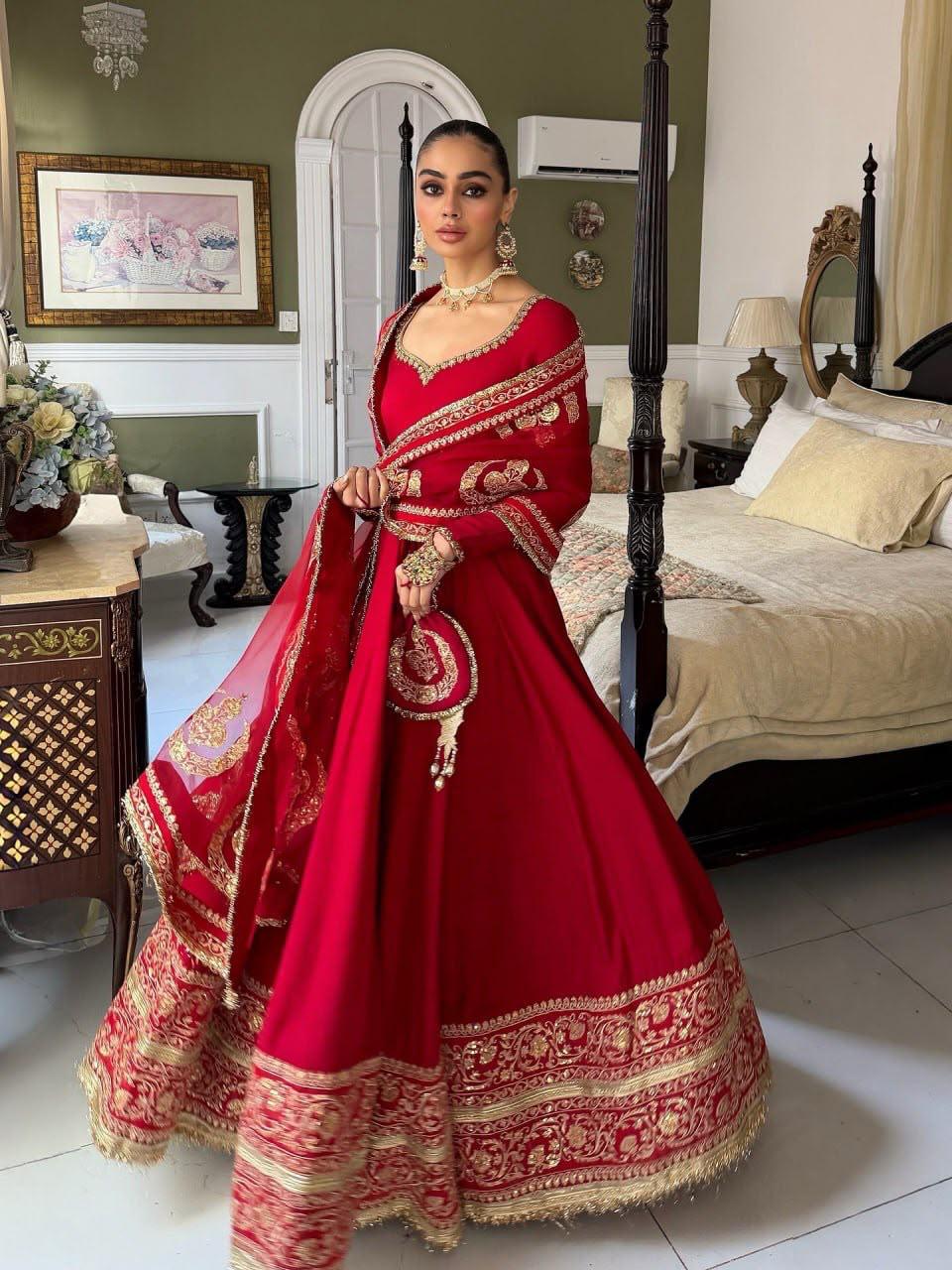 Red designer gown set with heavy sequin embroidery and full flare