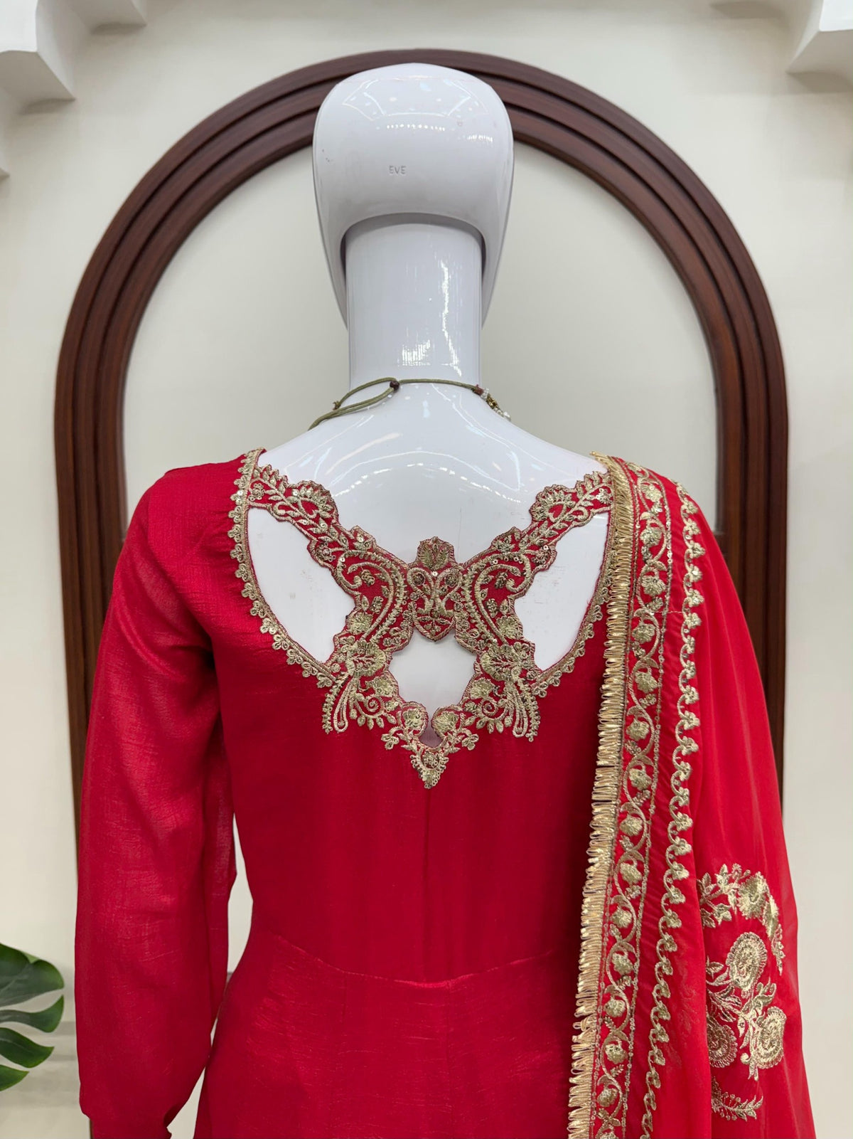 Red Fendy silk gown embroidered neckline close-up