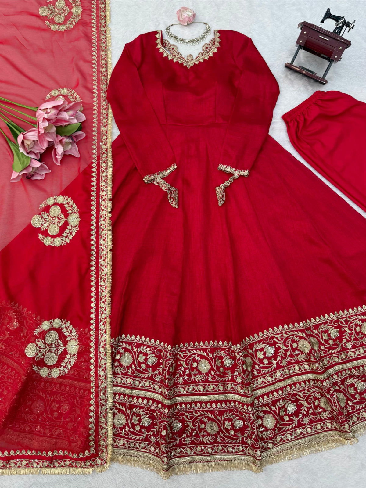 Red designer gown, pants and sequin embroidered dupatta flat lay