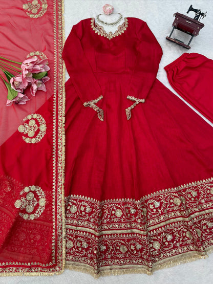 Red designer gown, pants and sequin embroidered dupatta flat lay