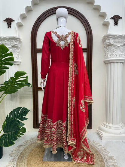 Red fully stitched designer gown set on mannequin