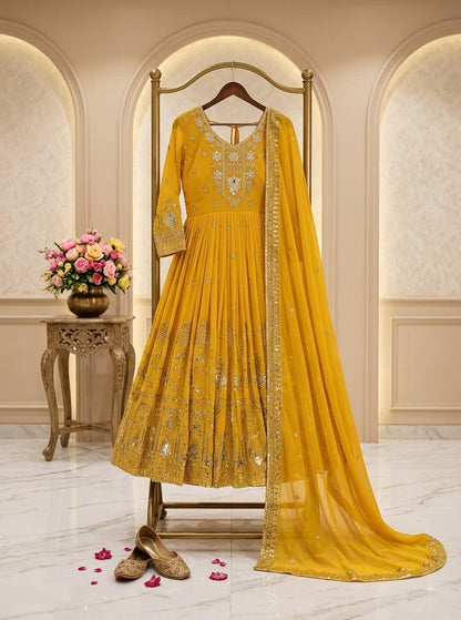 Mustard yellow Fox Georgette embroidered gown displayed with dupatta