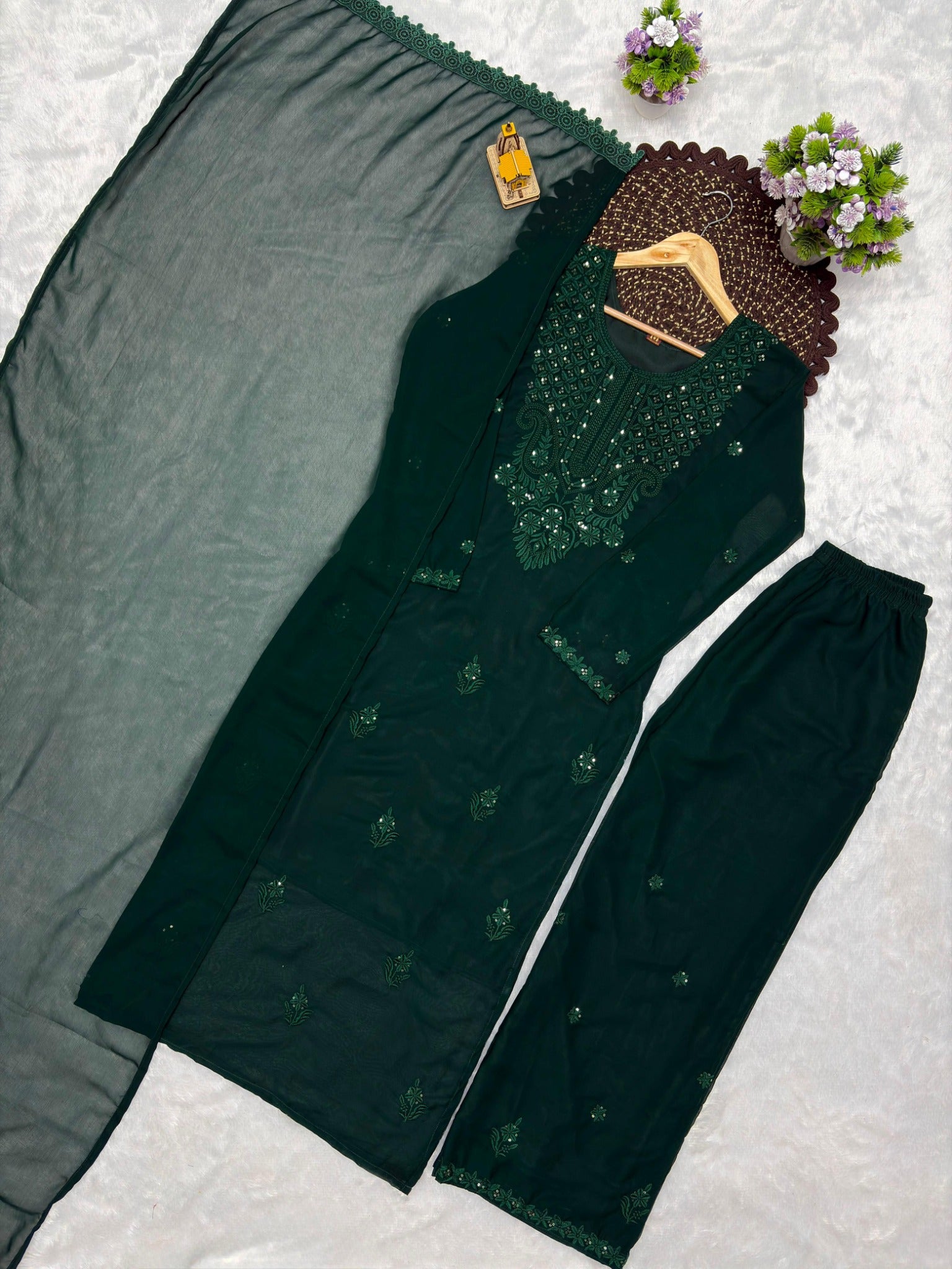 Dark green embroidered georgette kurta palazzo dupatta set flat lay