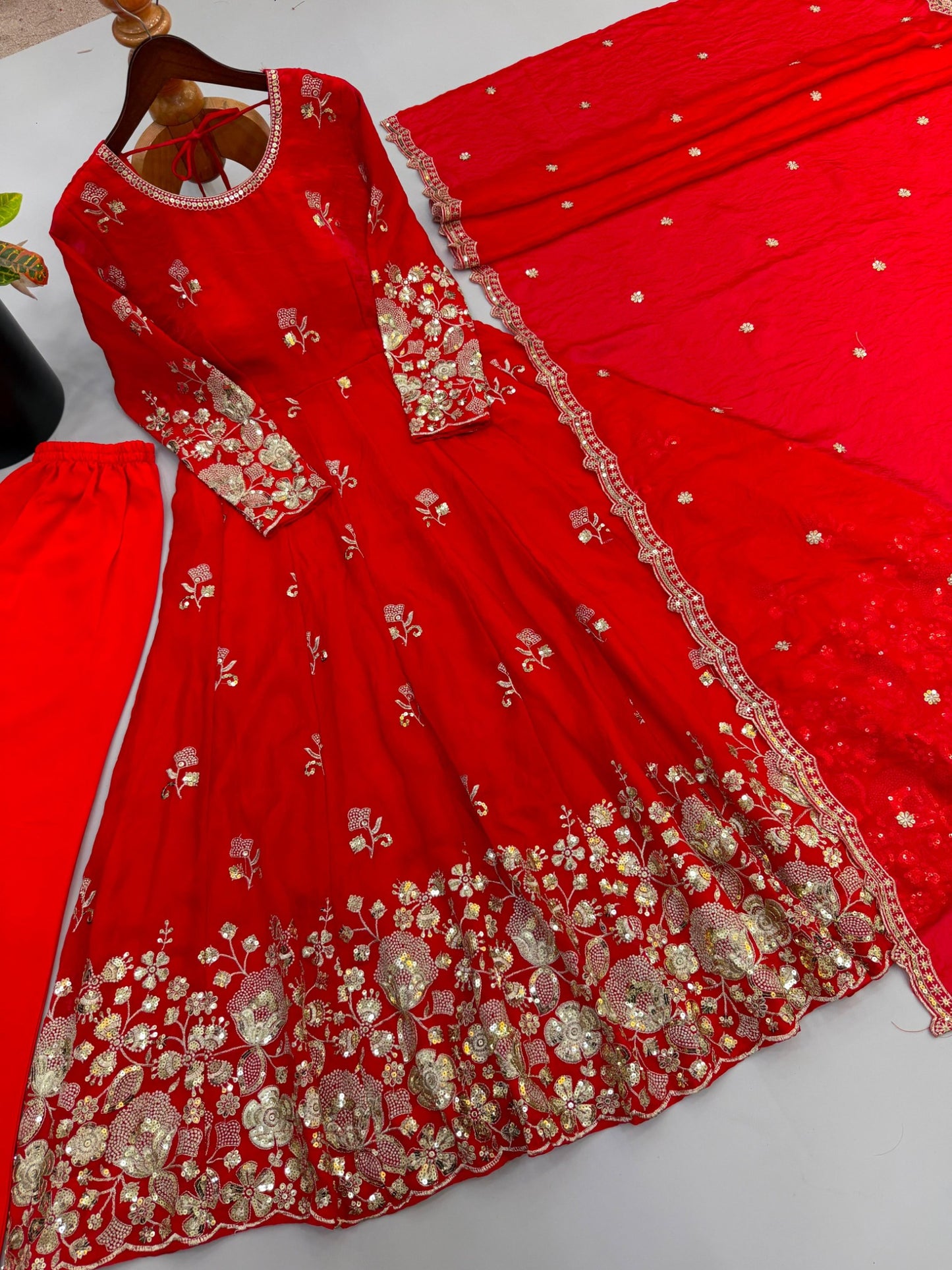 Red embroidered gown and dupatta detailed flat lay