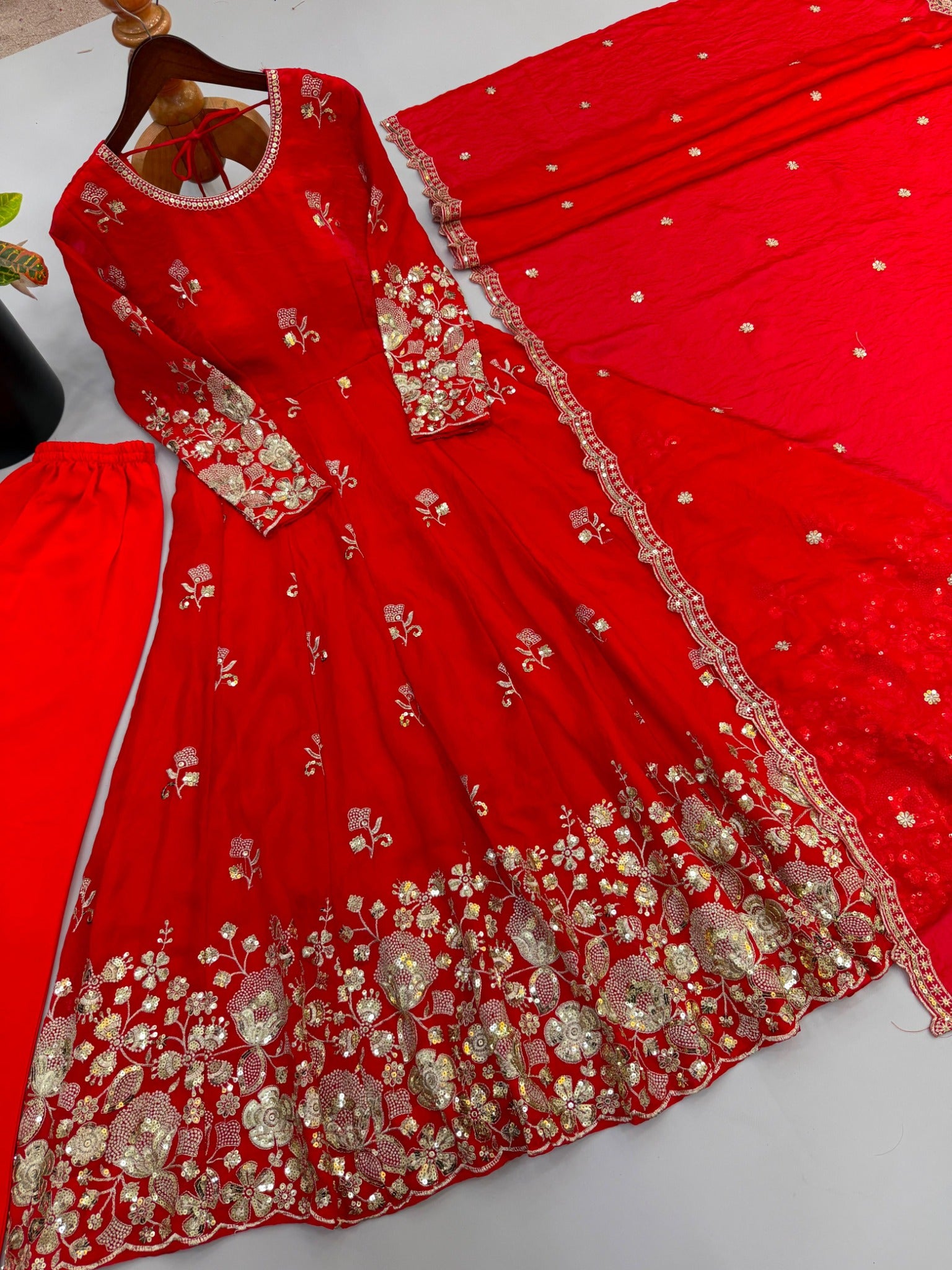 Red embroidered gown and dupatta detailed flat lay