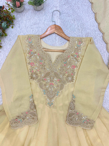 Close-up of beige cording and sequin embroidery neckline and sleeves