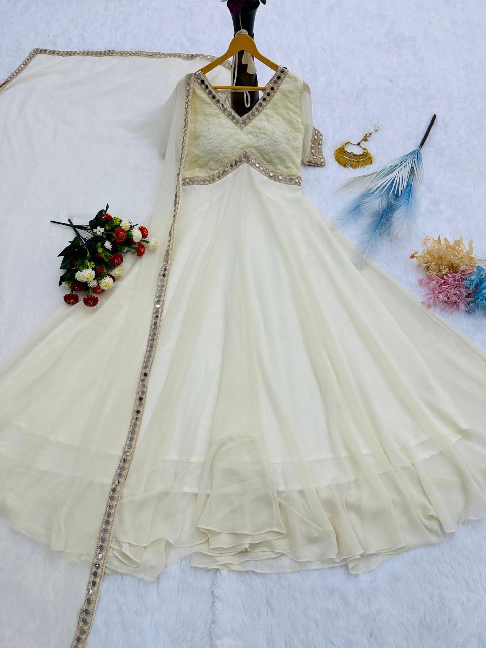 Off white faux georgette Anarkali gown flat lay with mirror work border