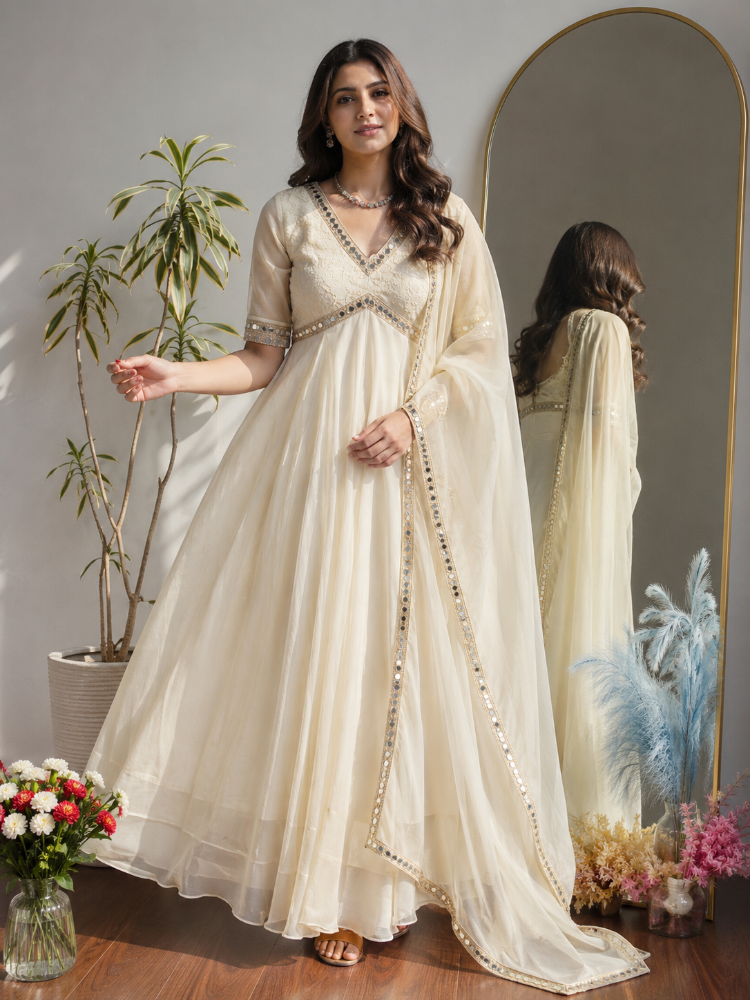 Off white designer Anarkali gown with mirror work lifestyle photo