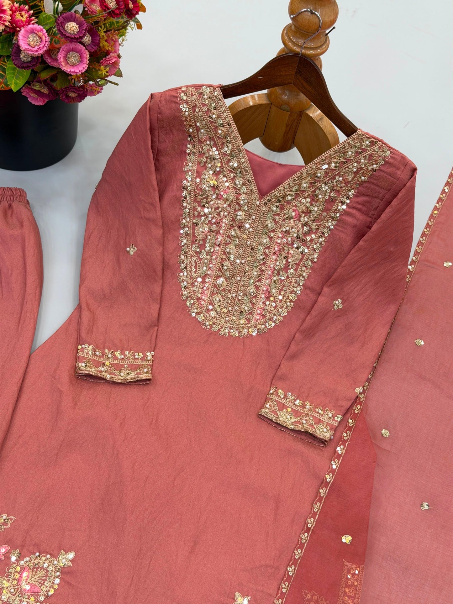 Heavy embroidery sequence neckline detail on Ronald Silk top